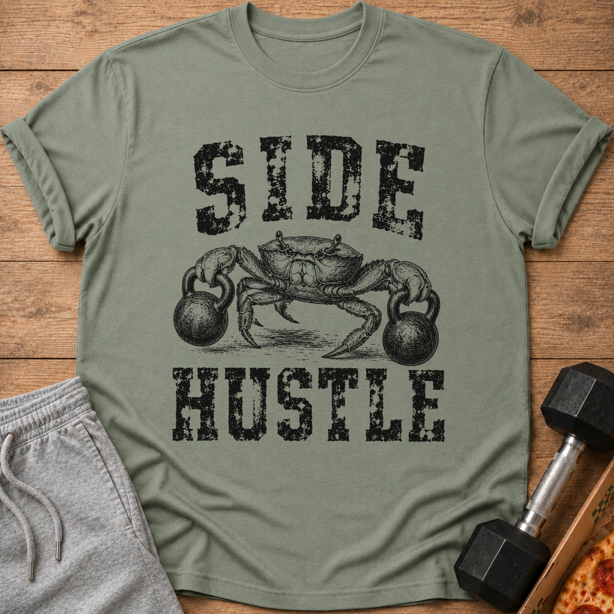 Olive green t-shirt with a crab holding kettlebells and "SIDE HUSTLE" text.