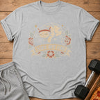 Grey t-shirt with graphic of a cat wearing a headband and text "SORE BUT FINE".
